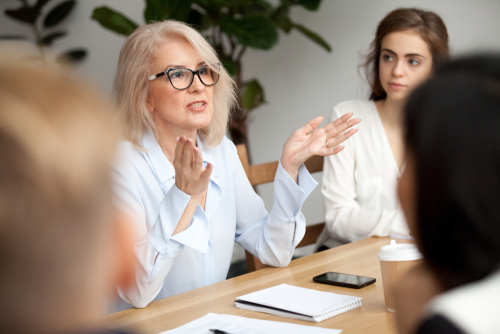 Female manager sharing information with her team